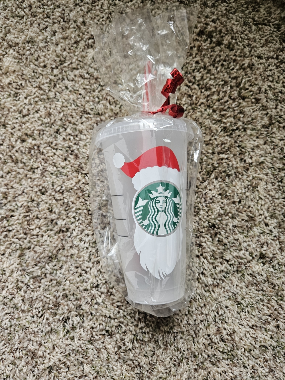 Starbucks White Tumbler with Red Santa Hat and Green Logo
